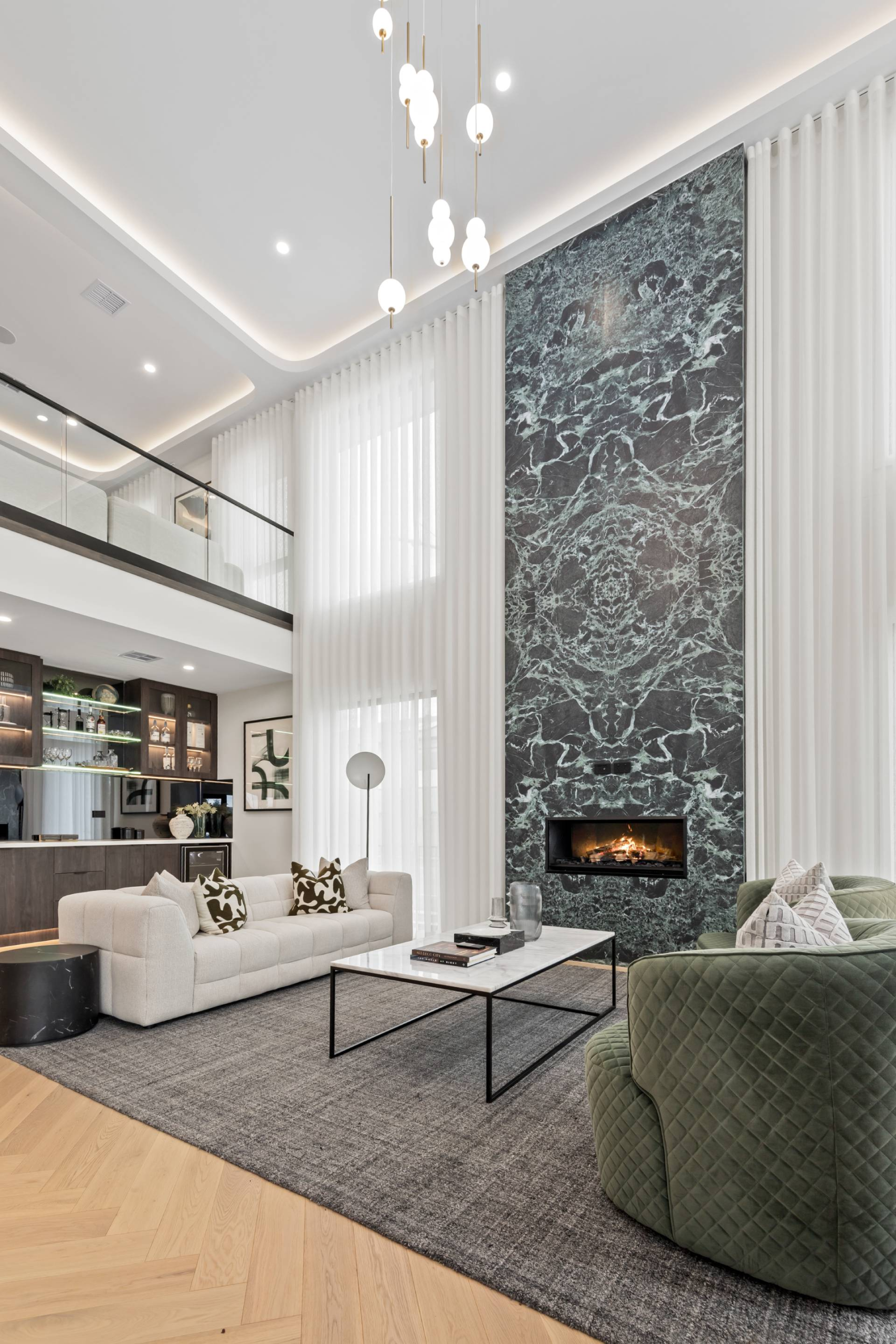 Grand Entry Void with Emerald Statement Fireplace — Newcastle 473